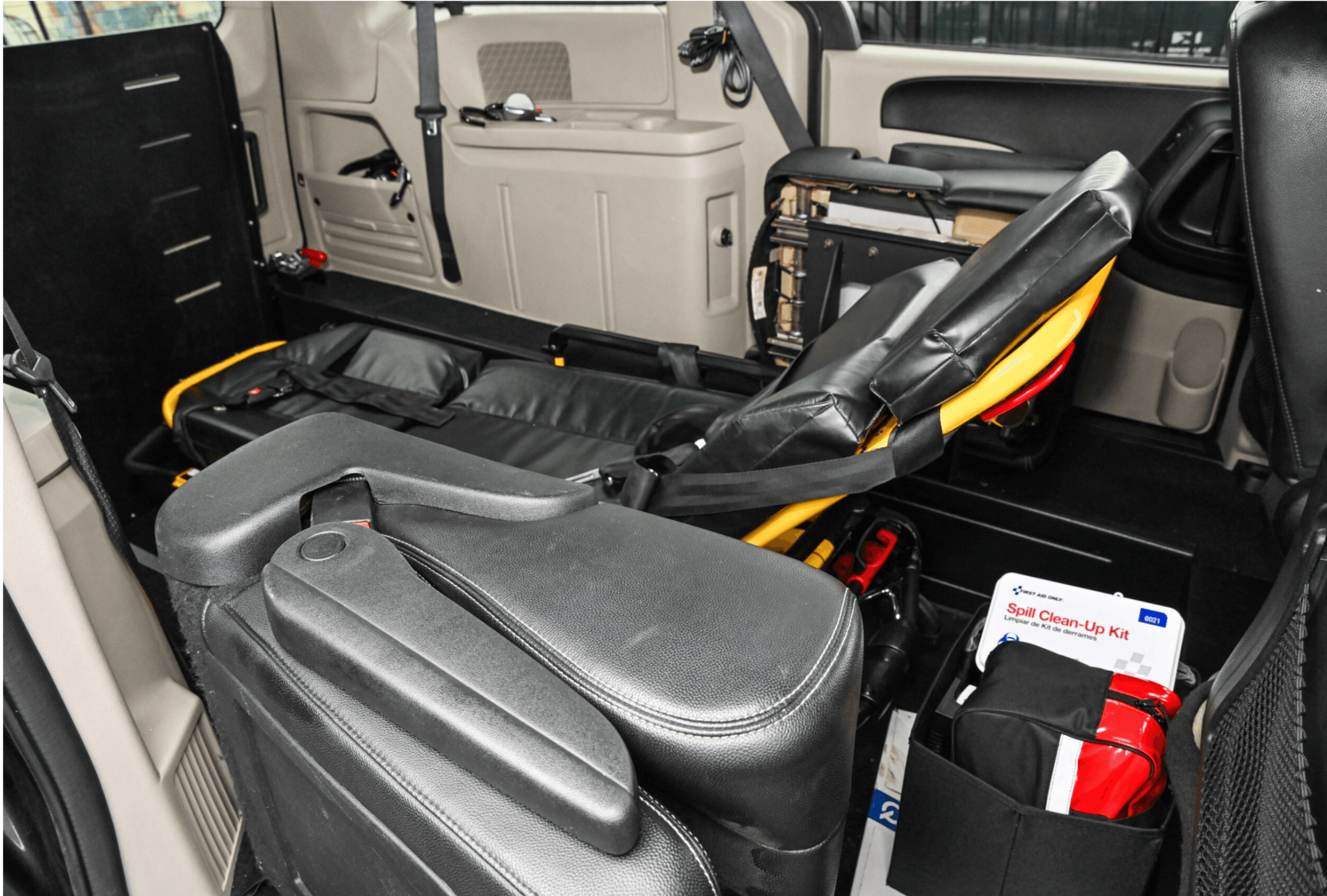 Driver assisting a patient with wheelchair loading