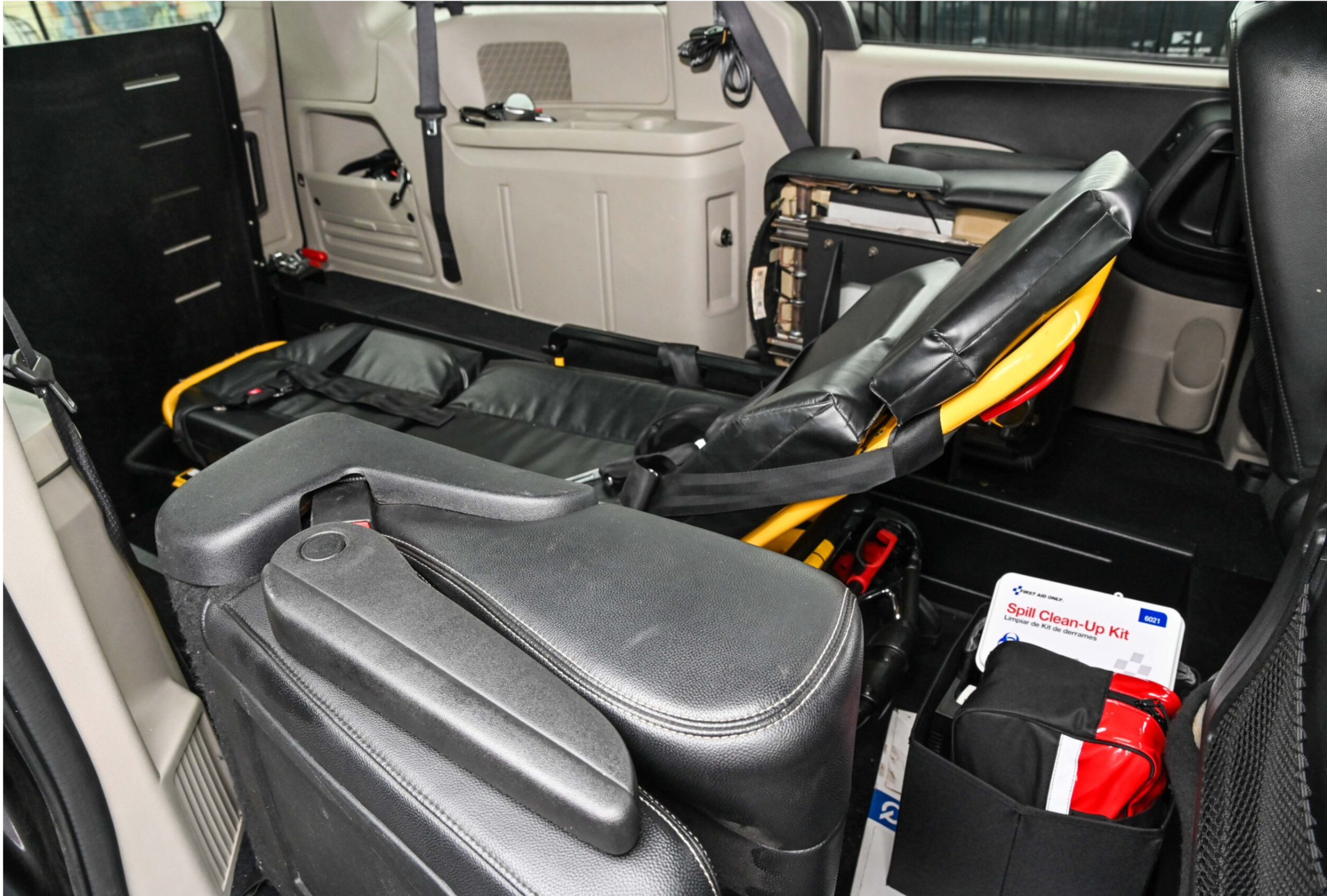 Inside view of a Well Transportation vehicle showing medical equipment and stretcher setup